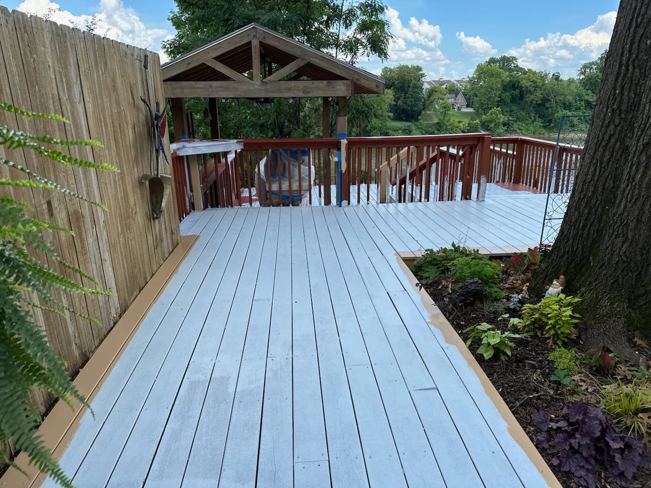 Before — old gray painted deck